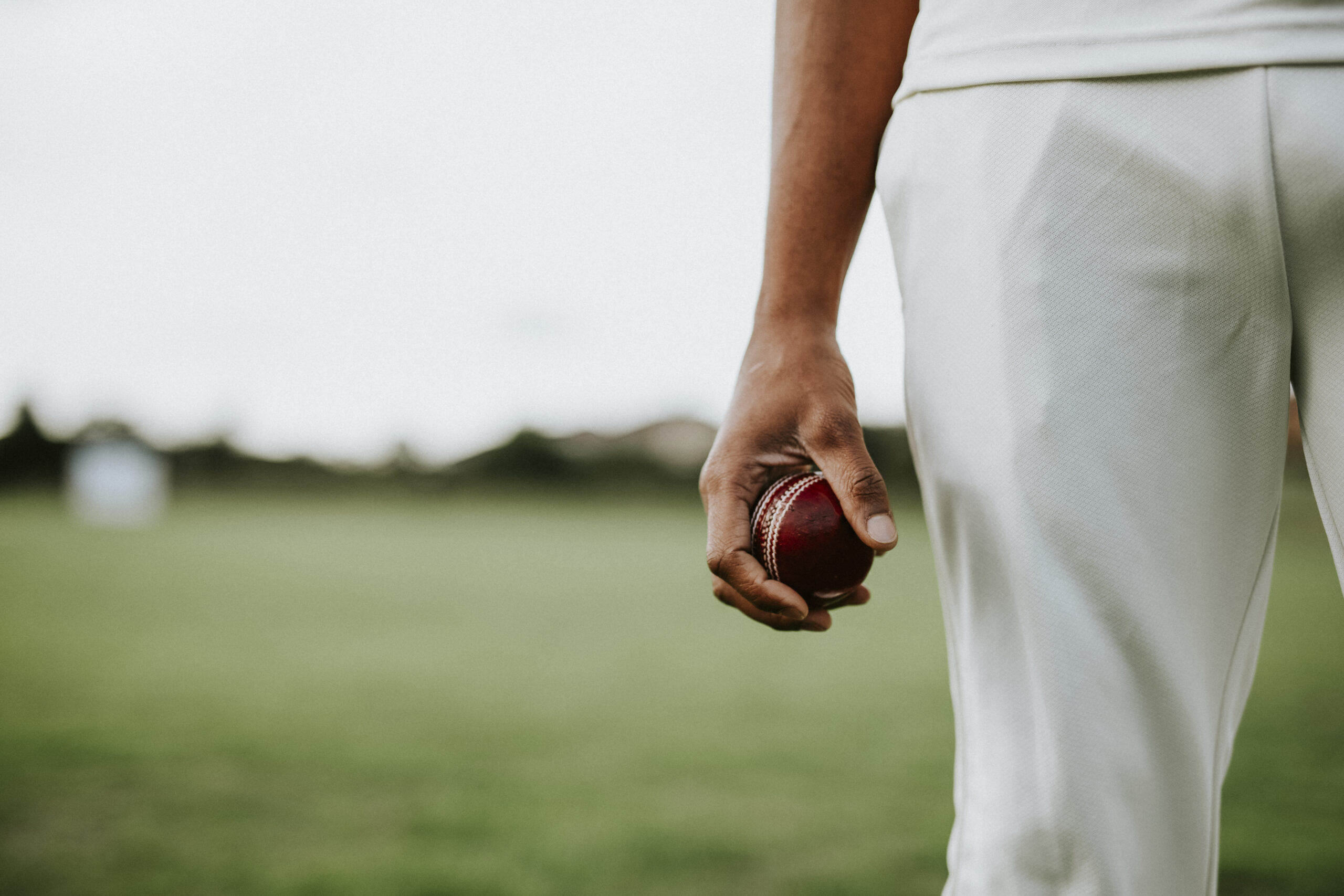 Cricket Player Holding Leather Ball Scaled